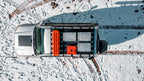 AluBox aluminum cases, overhead view of three cases on a truck roof rack in snow