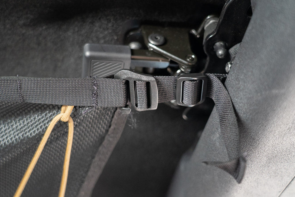 A Bronco mounting strap fitted at the roof, with the attic's paracord