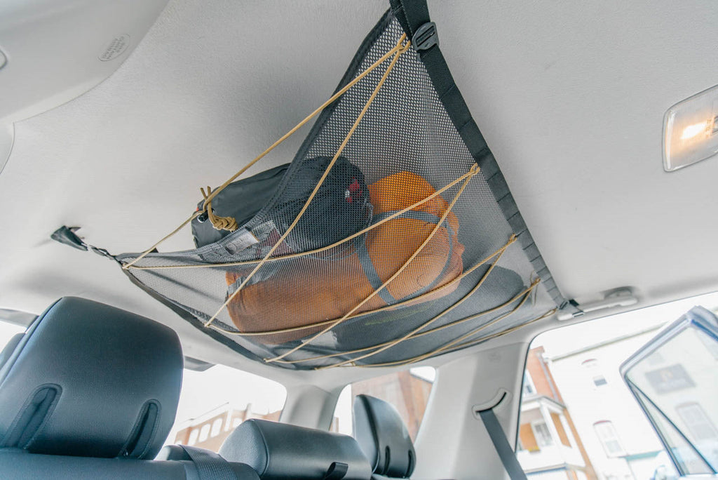The 4Runner attic from the side, cinched up toward the headliner with gear inside
