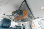 The 4Runner attic from the side, cinched up toward the headliner with gear inside