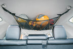 The 4Runner attic over the rear seats holding soft bags and a helmet