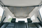 The 4Runner attic installed empty, mesh pulled flat to the headliner