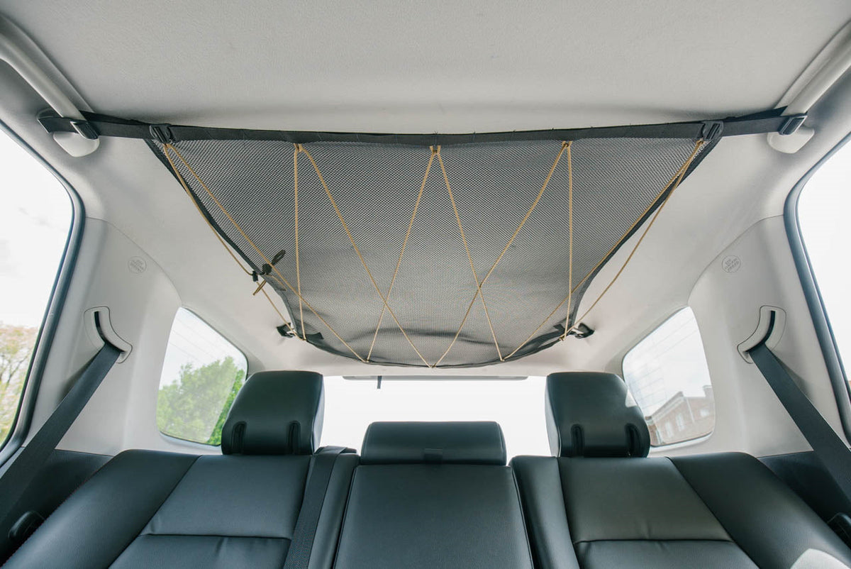 The 4Runner attic installed empty, mesh pulled flat to the headliner