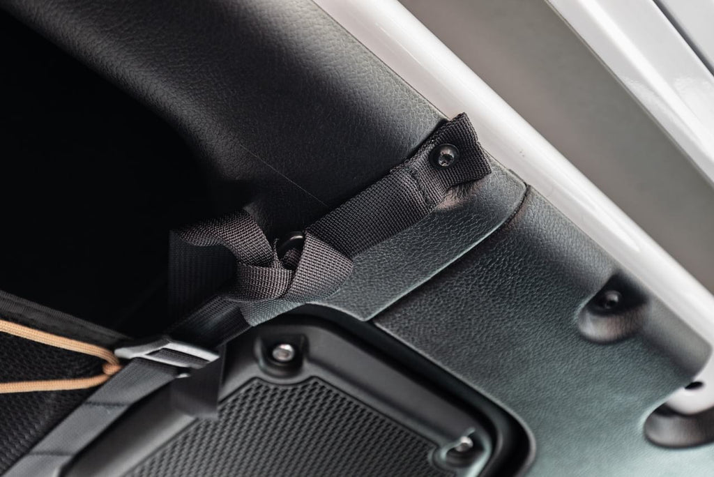 The JLU attic strap bolted in at an existing roll bar mount