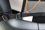 A webbing strap and buckle wrapped around the JLU roll bar