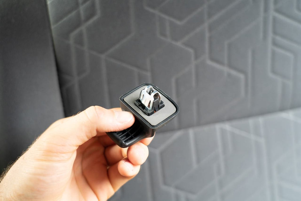 The mounting clip held up next to the headliner before it goes on