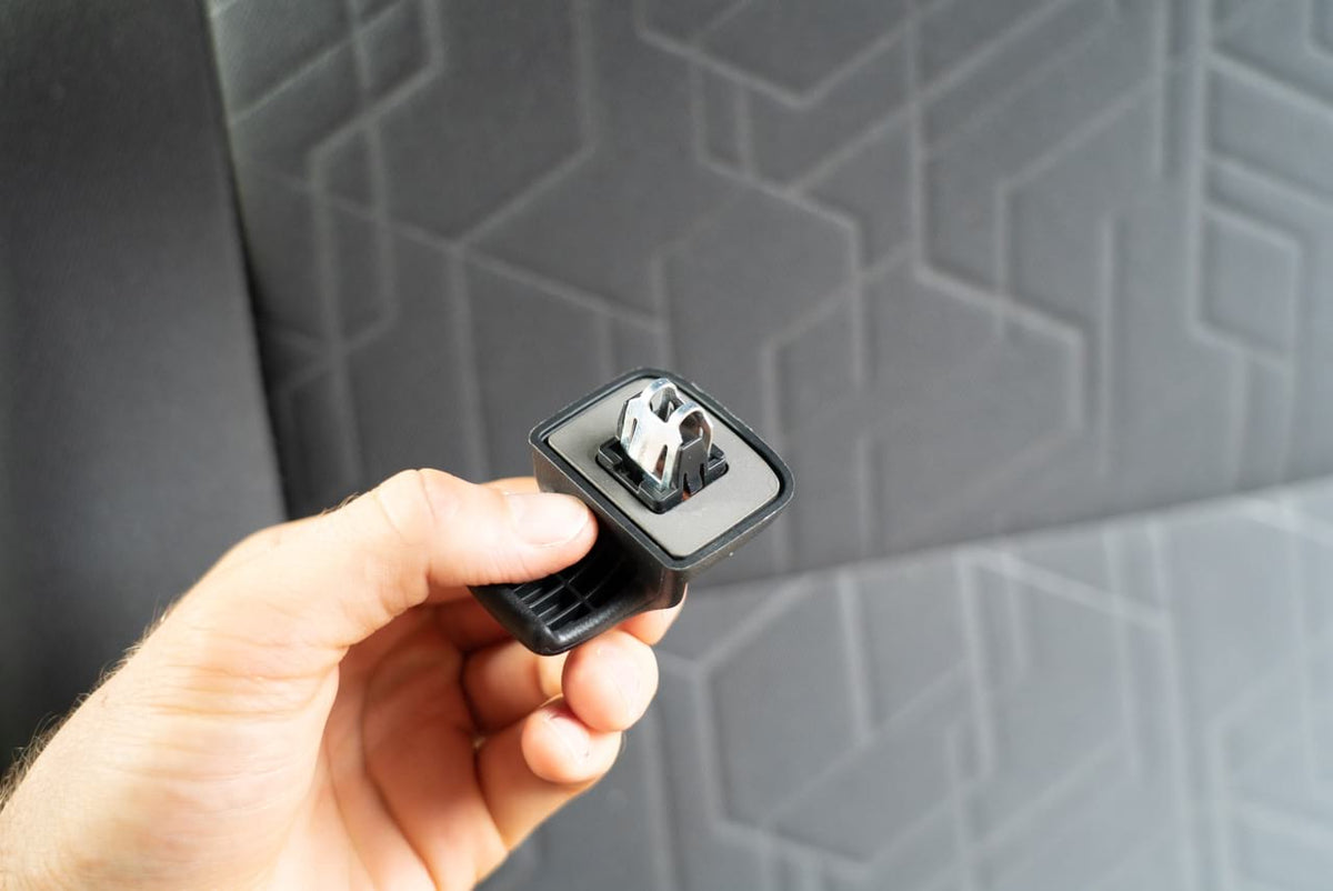 The mounting clip held up next to the headliner before it goes on