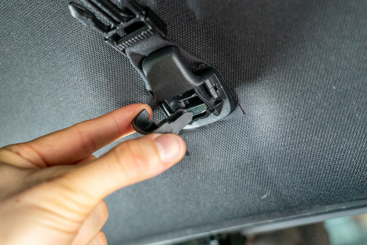 The mounting clip seated against the headliner