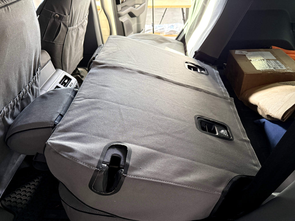 Escape Gear canvas seat covers, Ineos Grenadier, Grey rear seat back folded flat, showing the rear panel