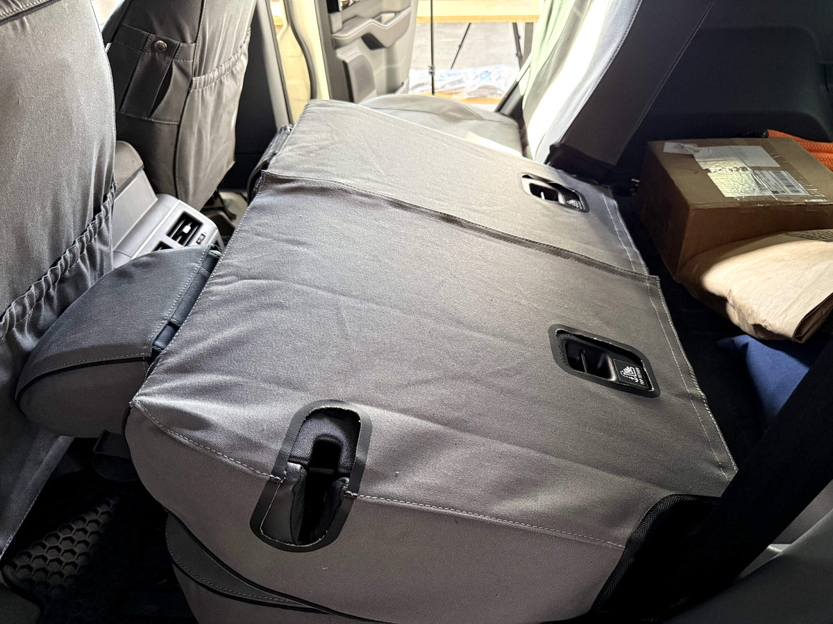 Escape Gear canvas seat covers, Ineos Grenadier, Grey rear seat back folded flat, showing the rear panel