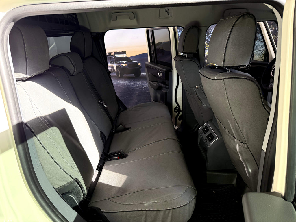 Escape Gear canvas seat covers, Ineos Grenadier, Grey rear bench and front seat backs through the rear door