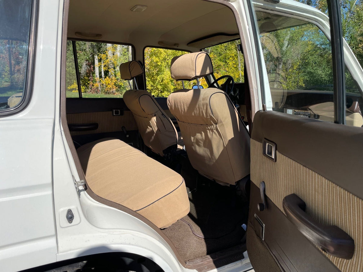 Escape Gear canvas seat covers, Land Cruiser 60 Series, Light Khaki rear bench and front seat backs through the rear door