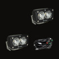 A pair of S2 Pro pods with clear spot lenses, shown with the wiring harness