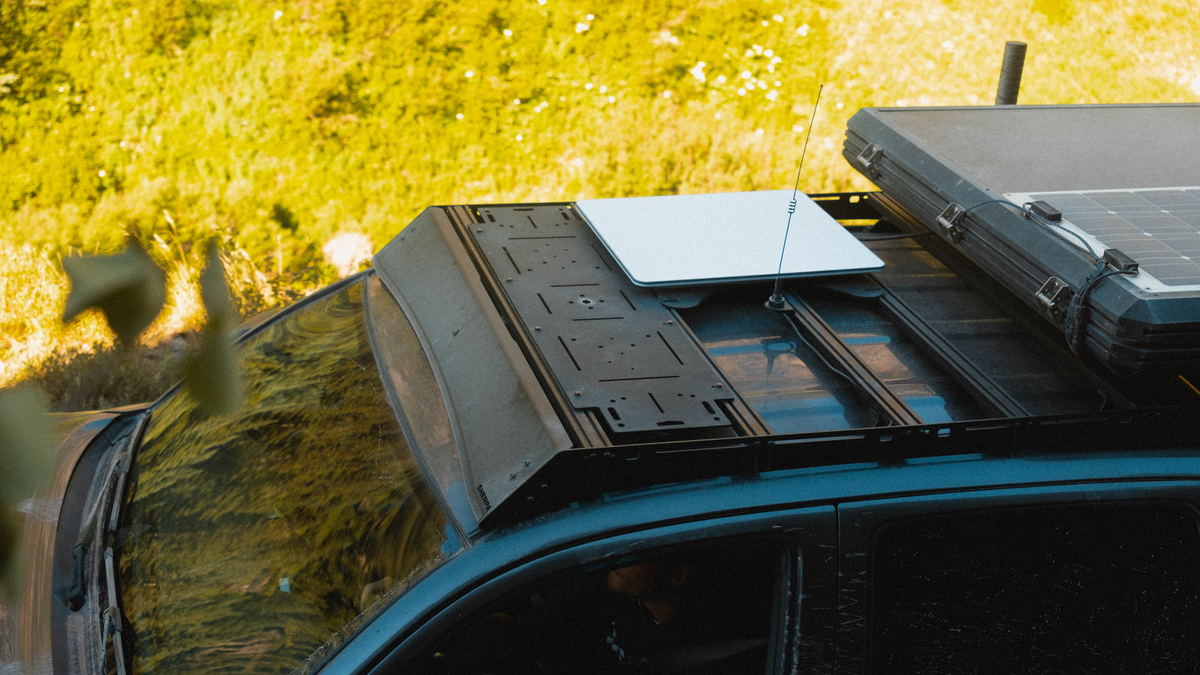 Adapt Plate on a rack with an antenna and a flat white dish