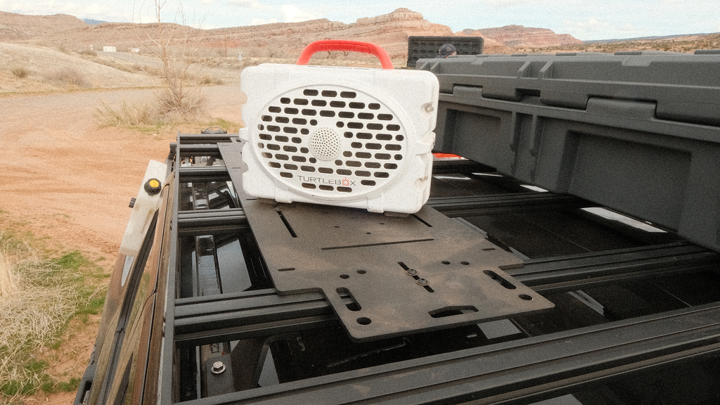 Adapt Plate across Sherpa crossbars carrying a speaker