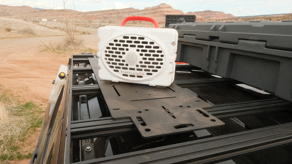 Adapt Plate across Sherpa crossbars carrying a speaker