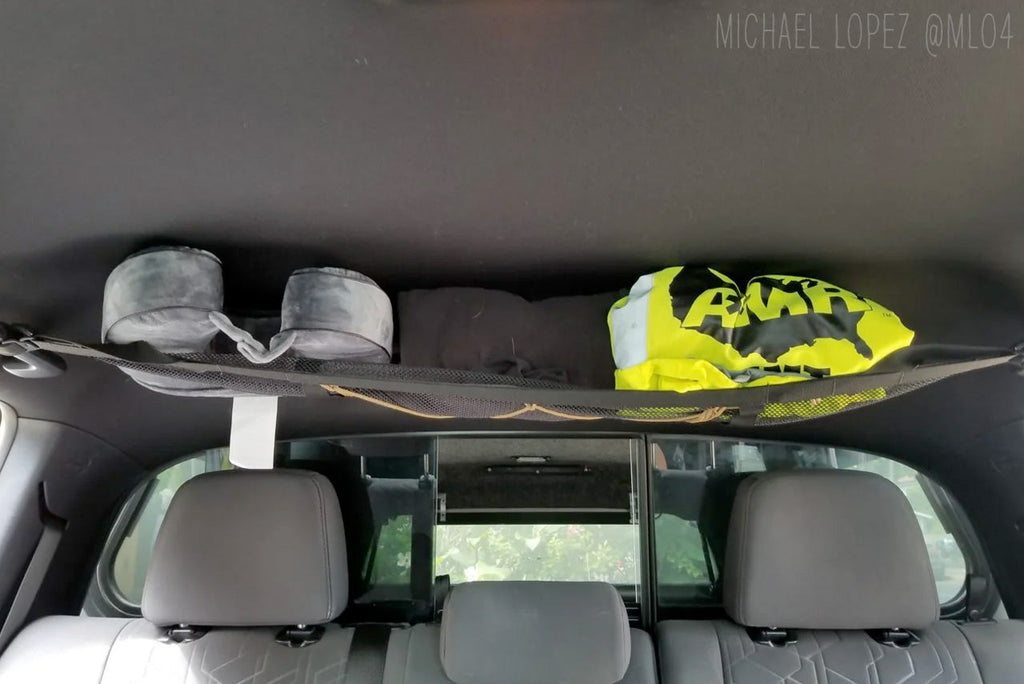 The loaded Tacoma attic from the front seats, customer photo