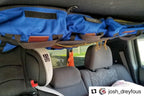 The Tacoma attic loaded with blue jackets above the rear seat, credited to a customer