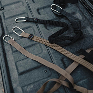 Colfax stretch cargo straps coiled, showing the metal hardware