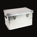 AluBox 60L aluminum case, lid closed, front three-quarter view on white, latches and side handle
