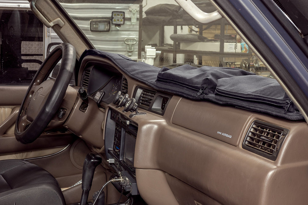 Escape Gear canvas dash cover in Grey on a truck dashboard, zip pouches on the passenger side