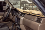 Escape Gear canvas dash cover in Light Khaki on a truck dashboard, zip pouches on the passenger side