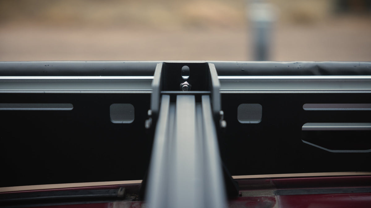 Sherpa awning mount on a crossbar, seen from the side of the rack