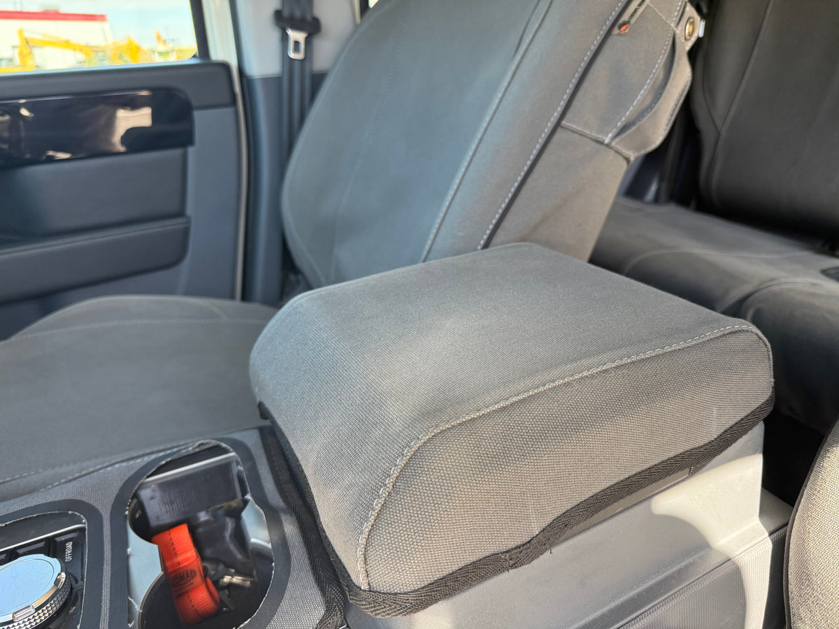 Escape Gear canvas seat covers, Ineos Grenadier, Grey armrest cover close-up between the seats