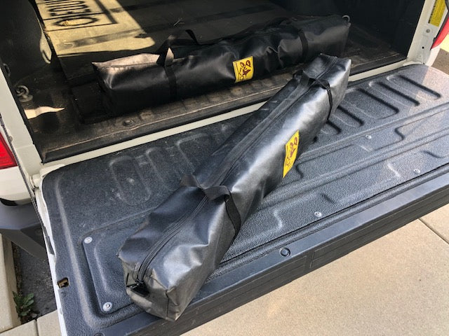 Eezi-Awn K9 Fold A Chair, two carry bags, one on the tailgate and one in the truck bed
