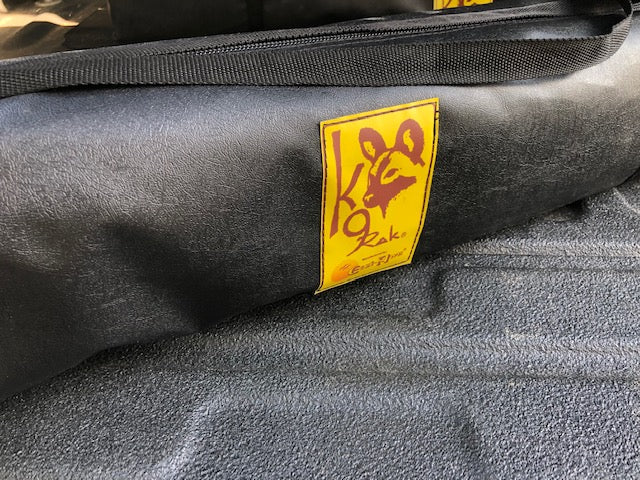 Eezi-Awn K9 Fold A Chair, close-up of the yellow K9 logo patch on the carry bag