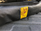 Eezi-Awn K9 Fold A Chair, close-up of the yellow K9 logo patch on the carry bag