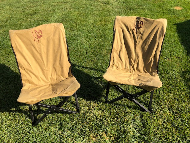 Eezi-Awn K9 Fold A Chair, two Beige chairs set up side by side on grass