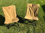 Eezi-Awn K9 Fold A Chair, two Beige chairs set up side by side on grass