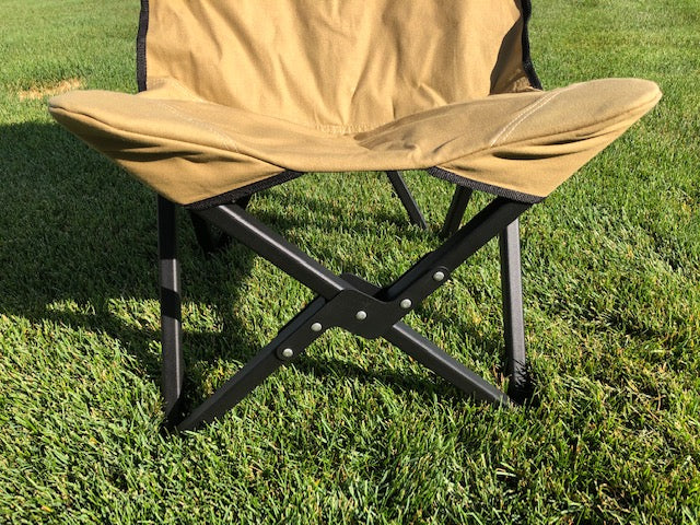 Eezi-Awn K9 Fold A Chair, close-up of the Beige seat edge and black folding X-frame