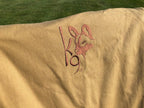Eezi-Awn K9 Fold A Chair, close-up of the embroidered K9 logo on the Beige canvas back