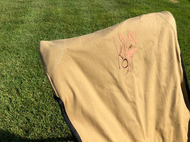 Eezi-Awn K9 Fold A Chair, Beige canvas back with embroidered K9 logo, side view
