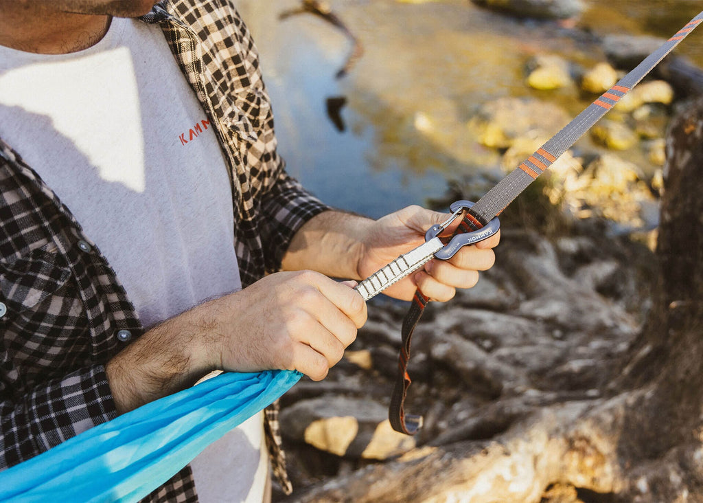 Clipping a Kanga Claw carabiner onto a tree strap