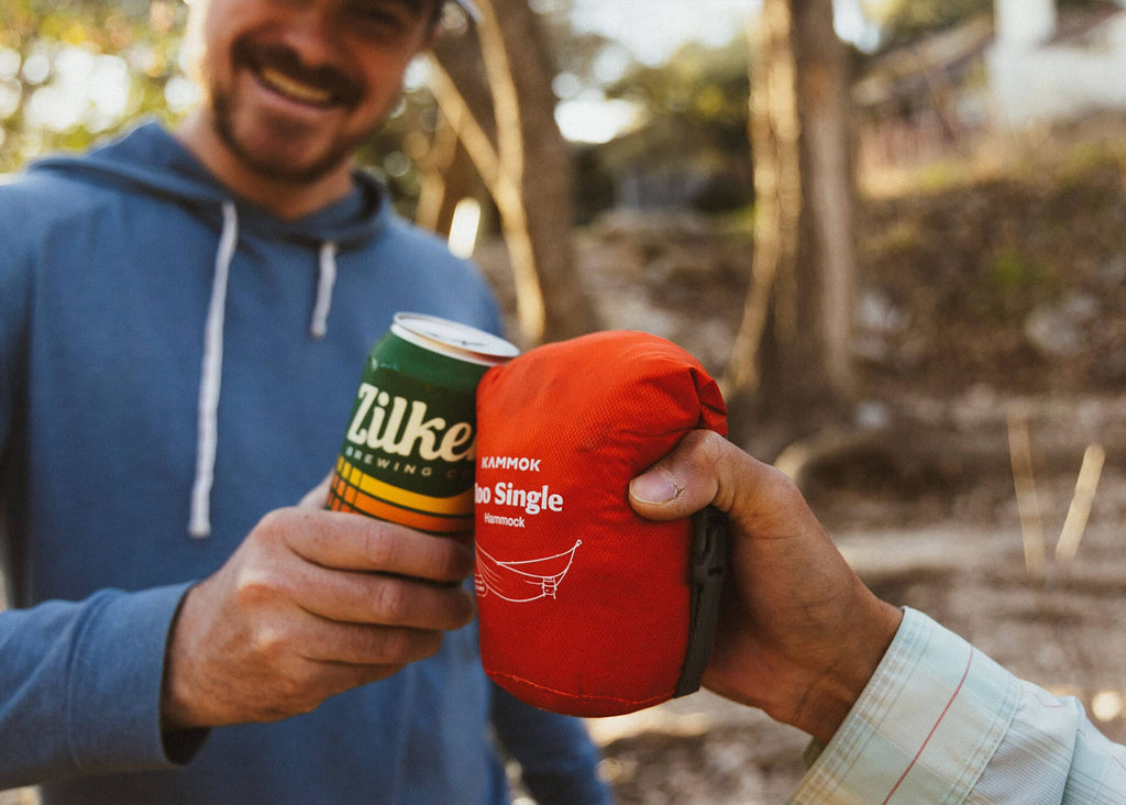 The packed Roo Single held next to a beer can, about the same size