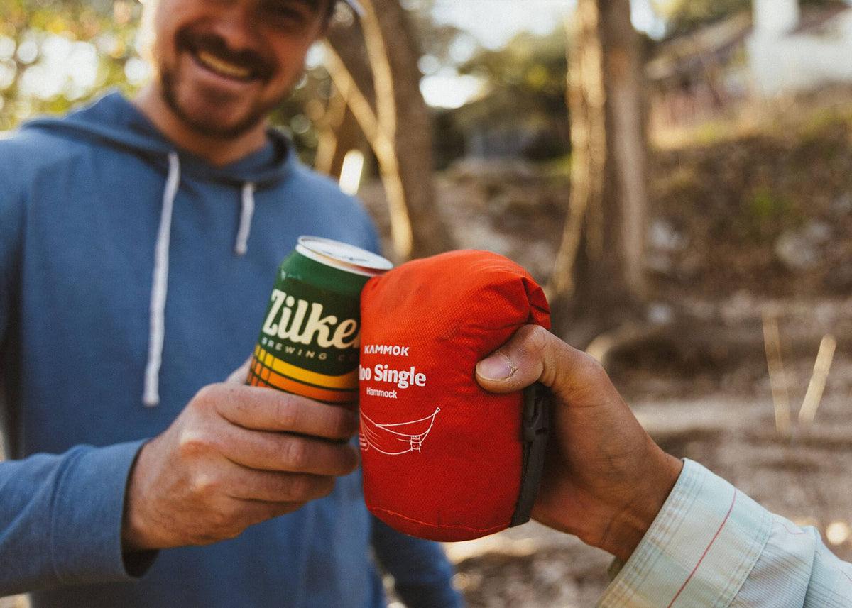 The packed Roo Single held next to a beer can, about the same size