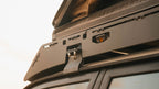 Close-up of a La Sal sideplate, gutter mount and cutouts below a rooftop tent