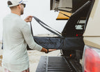 Pulling the Outpost travel bag out of a truck bed