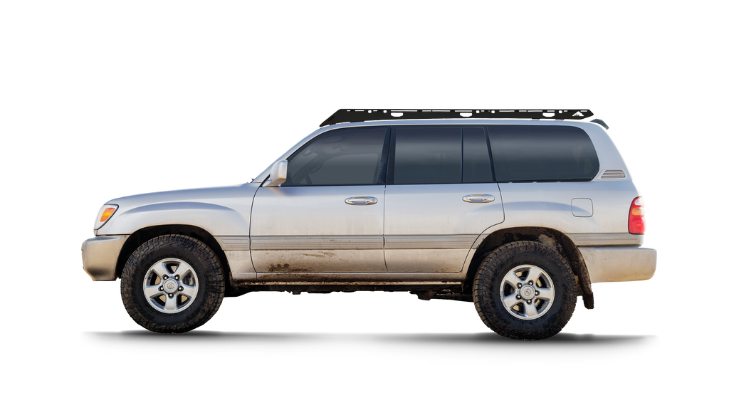 Silver 100 Series Land Cruiser with a black Sherpa Oxford rack, side view on black