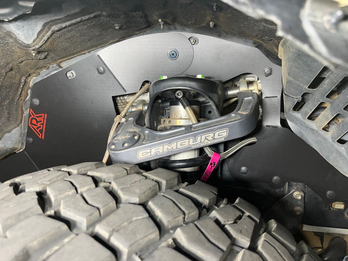 Ark TriXpoly splash guard with red logo above the front tire of a Land Cruiser 200 Series