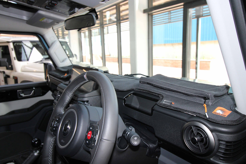 Escape Gear canvas dash cover in black on an SUV dashboard, with a zip pouch and logo tag