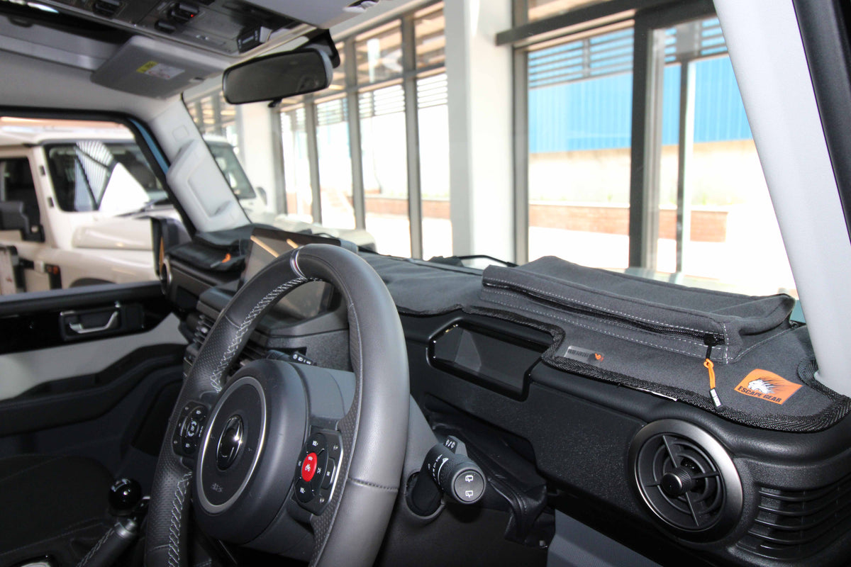 Escape Gear canvas dash cover in black on an SUV dashboard, with a zip pouch and logo tag