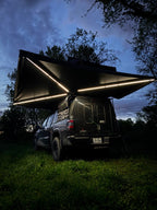Reign 270 with the arm LEDs on red, rear three-quarter view