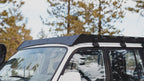Front three-quarter of the La Sal rack and fairing on a white 80 Series with a snorkel