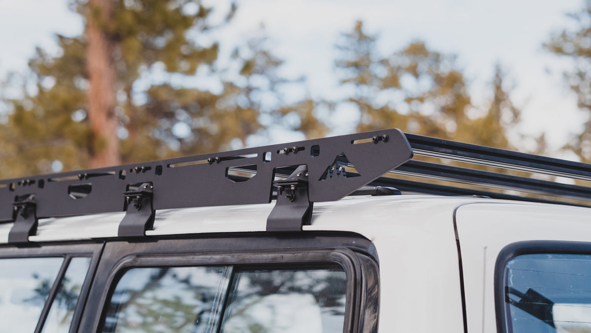 La Sal sideplate and three gutter mounts along a white 80 Series roof